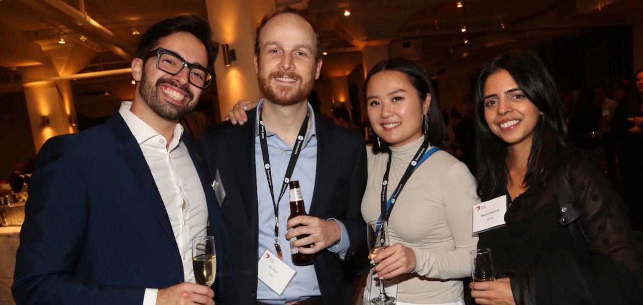 A group of four people posing at a CANY event